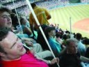 Blind people enjoying a MLB baseball game.