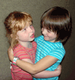 Two blind girls hugging