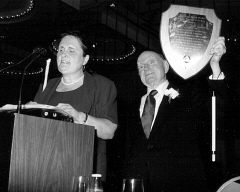 Ramona Walhof reads the text of the tenBroek Award while Tim Cranmer displays the plaque.