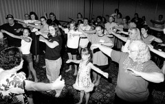 Nani Fife teaches a room full of Federationists how to do the Hula.