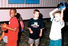 Anthony Lindsey from Tennessee, Jeffrey Gabias from Canada, and C.J.Wallace from North Carolina shoot baskets in NFB Camp