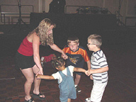 Kids play a circle game at NFB Camp.