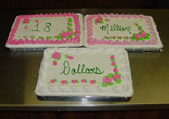Three cakes are pictured here, each bearing one of the three exciting words, "Eighteen Million Dollars"