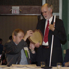 Gary Wunder presents a plaque to Ed Bryant.