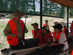 Jim Marks teaching gun safety to an eager class of young students.
