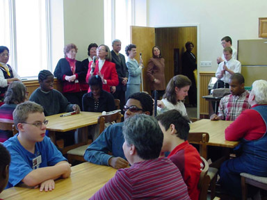 Students gathered in the Harbor Room, where Barbara Cheadle talked with them about the significance of the fact that blind students now have access to some of the photos their sighted friends have been able to study for years.