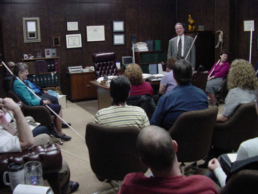 Members of the most recent NFB leadership seminar are seated in President Maurer's office, listening to what he is saying.