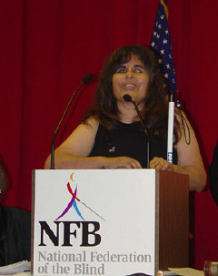 Caroline Rounds addresses the 2003 banquet.