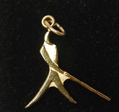 Whozit charm, gold, $15; silver, $10
