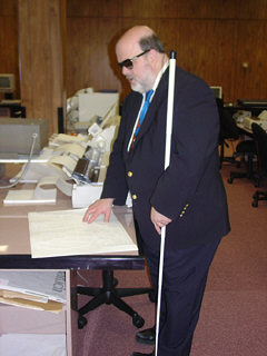 Robert Jaquiss examines a tactile map of the United States produced by the Tiger Pro.