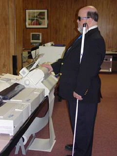 Robert Jaquiss stands with his hand on the Tiger Pro.   The Tiger Pro Max in the middle, and the Tiger Cub is on the far left.