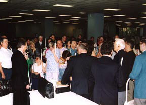 President Maurer talks with staff and volunteers as they prepare to unload the trucks and set up the NFB store in the exhibit hall.