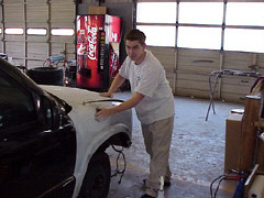 Rick French buffs out the wax that he has applied to this car