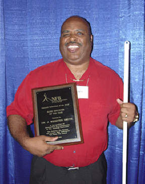 Dr. J. Webster Smith displays his plaque.