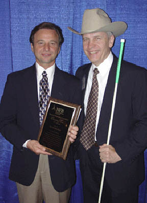 Steven Schechner (left), holding his award, and Dr. Norm Gardner