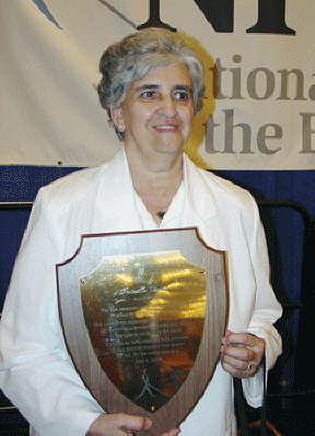 Priscilla Ferris holds her plaque.