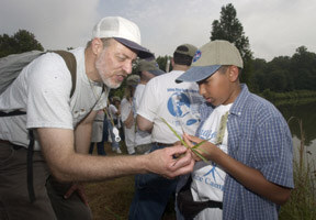 Jordan Richardson gets help identifying a plant from a NASA volunteer at the Goddard Space Flight Center in Maryland.