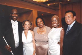 At  this year's Third Annual Black Tie-White Cane Appreciation Banquet, Anil Lewis, president of the National Federation of the Blind of Georgia, and second vice president Thelma Godwin, the event chairperson stand with Rev. Magdalene Womack, WSB-TV Channel 2 News Anchor Monica Kaufman, the keynote speaker, and Ambassador Andrew Young chairman of the event.   Ambasador Young serves as Chairman of GoodWorks International Foundation, while Rev. Womack is its Vice-Chairman of Public Affairs.
