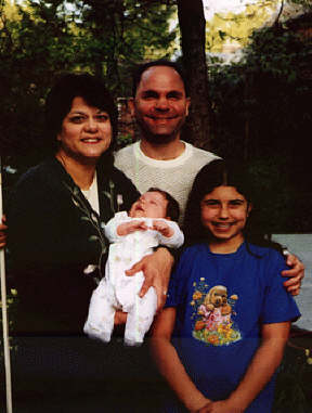 The Ley family: Eileen holding Jon Carlos, Tom, and Maria.
