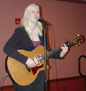 Brooke Fox plays guitar at the showcase of talent.