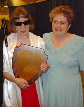 Ramona Walhof and Barbara Loos are pictured here.   Barbara holds her plaque.