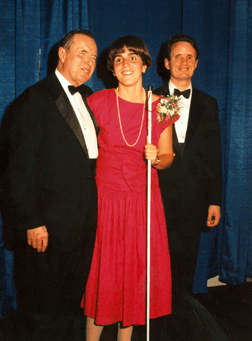 Pam Dubel Allen, director of the Louisiana Center for the Blind, president of the NFB of Louisiana, and member of the NFB board of directors, won the top scholarship presented by the NFB at its annual convention in 1991. She is pictured here with Kenneth Jernigan (left) and President Maurer (right).