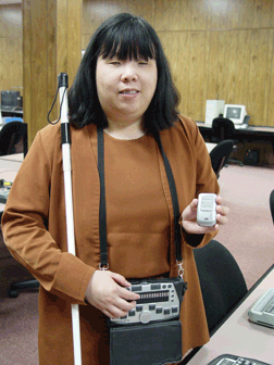 Anne Taylor, IBTC director of access technology, demonstrates the BrailleNote GPS