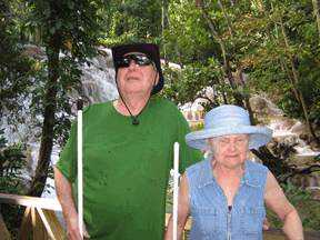 Ray and Diane McGeorge are pictured with Dunns Falls in the background.