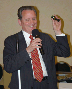President Marc Maurer tries out a duck call at Karaoke Night.