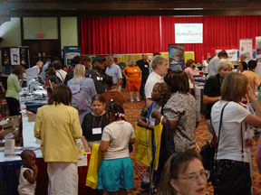 A sea of people fill last years exhibit hall.