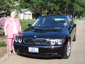 Sharon Gold is pictured here with her bonus car, a metallic black BMW 745 LI.   She will receive her sixth bonus car later this year.