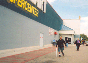 During a meet and greet event at the South Side Wal-Mart in Pueblo, Colorado, chapter president Alyce Bouy organized white cane races and relays. Ron Lucero (who won the race and later joined the chapter) is shown in front, along with Rick Holcomb (a chapter board member) who came in second.