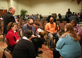 The legislative issue seminar divided into small groups to practice making their presentations to senators played by Federationists.