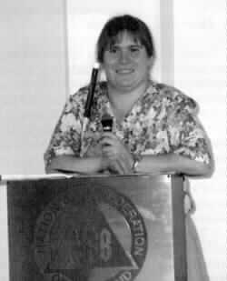 Photo of Ellen Ringlein reading Braille