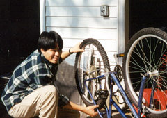 Chaz Cheadle - who did his share of taking out the trash and other chores - fixes his sister's bike.