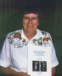 Doris Willoughby holds a copy of her book.