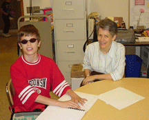 Brian Kelley and his Braille teacher, Alison Mckee.