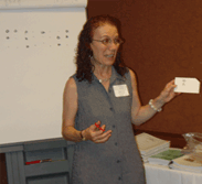 Carol in front of her class.