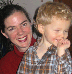 Mother and son smile together.