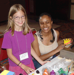 Two young girls smile for the camera.