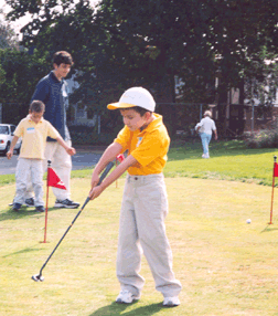 Even at age six, Patrick Molloy recognizes the importance of a strong golf swing