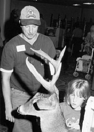 Mark McClain and daughter, Macy, explore the stuffed animals at a Sensory Safari display.