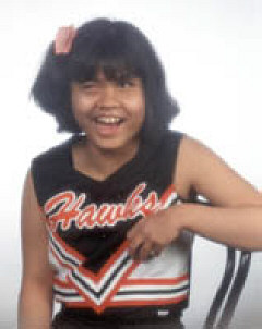 Emilie Schultz in her official Hawkes cheerleading outfit