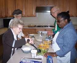 Annette teaching a kitchen class.  In order to graduate from the BISM training program, pupils are required to cook a meal for 20-30 people.