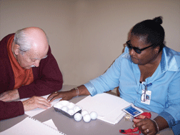 Annette teaching Braille