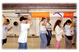 Kids placing rocket on launcher