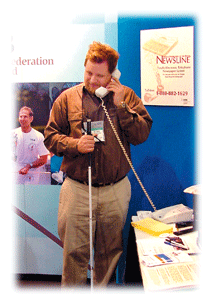 Blind man using Newsline