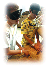 Blind children working with clay