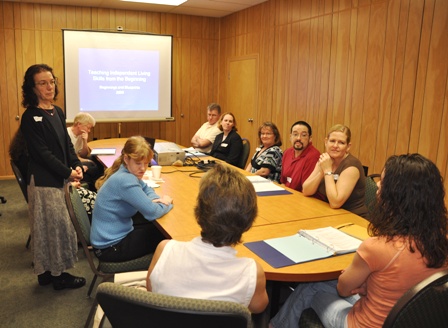 Carol Castellano instructing a work group at the conference.