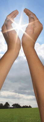 Hands cupping burst of sunlight